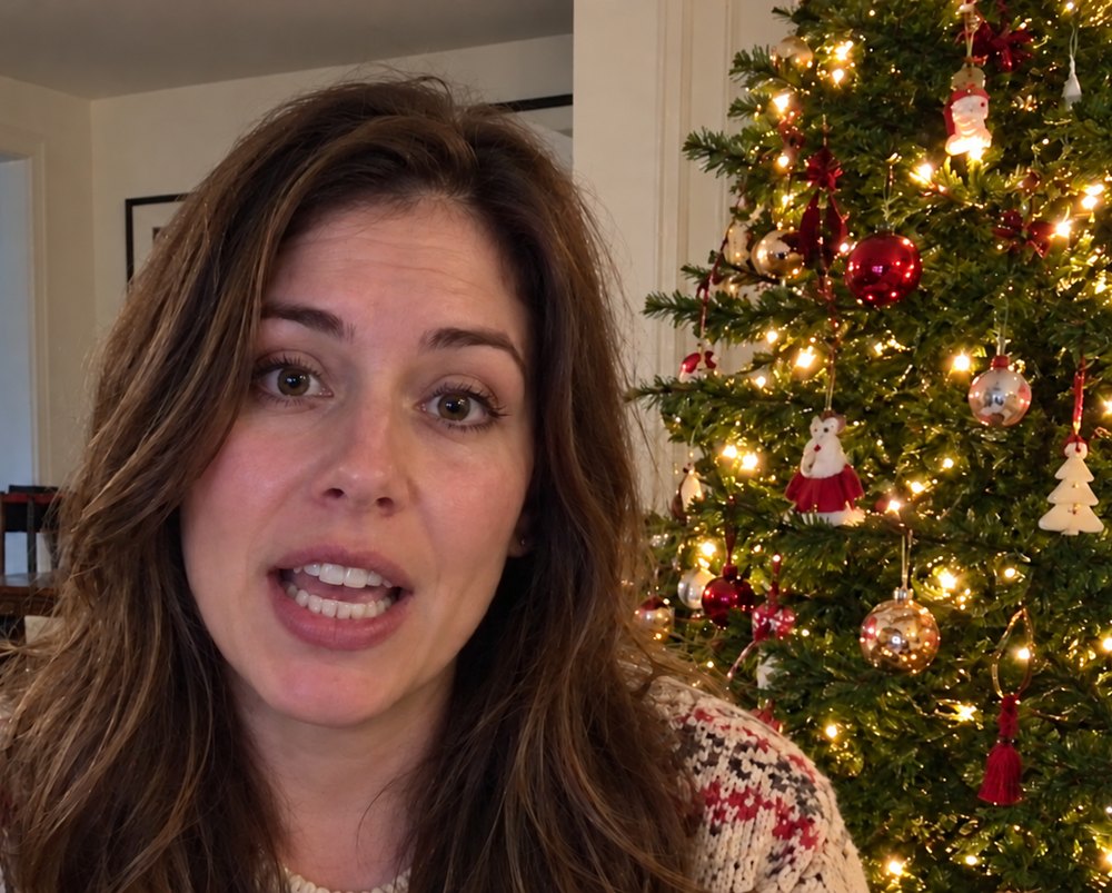 Lauren Mitchell in her living room by her Christmas tree